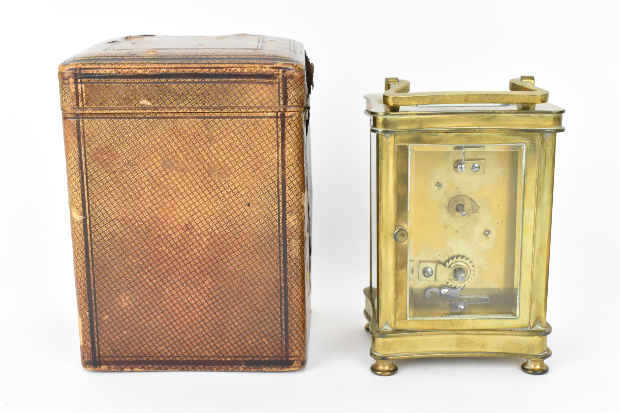 An early 20th century brass cased carriage clock in a fitted travel case having a white enamel - Image 3 of 10