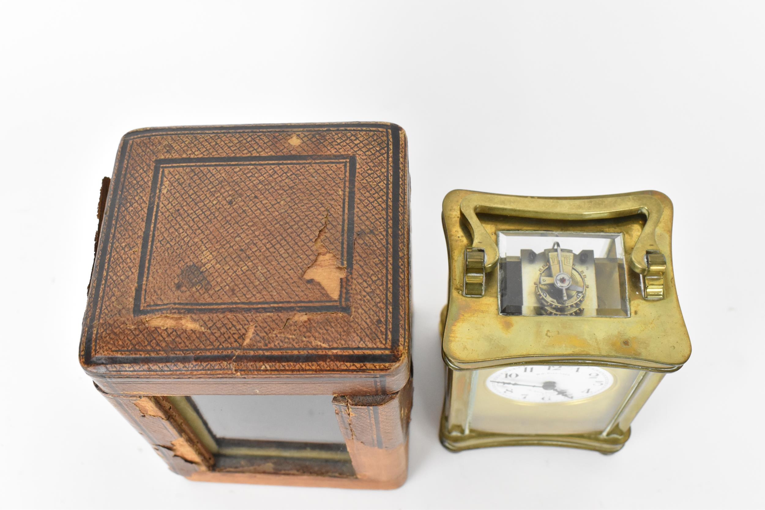 An early 20th century brass cased carriage clock in a fitted travel case having a white enamel - Image 5 of 10
