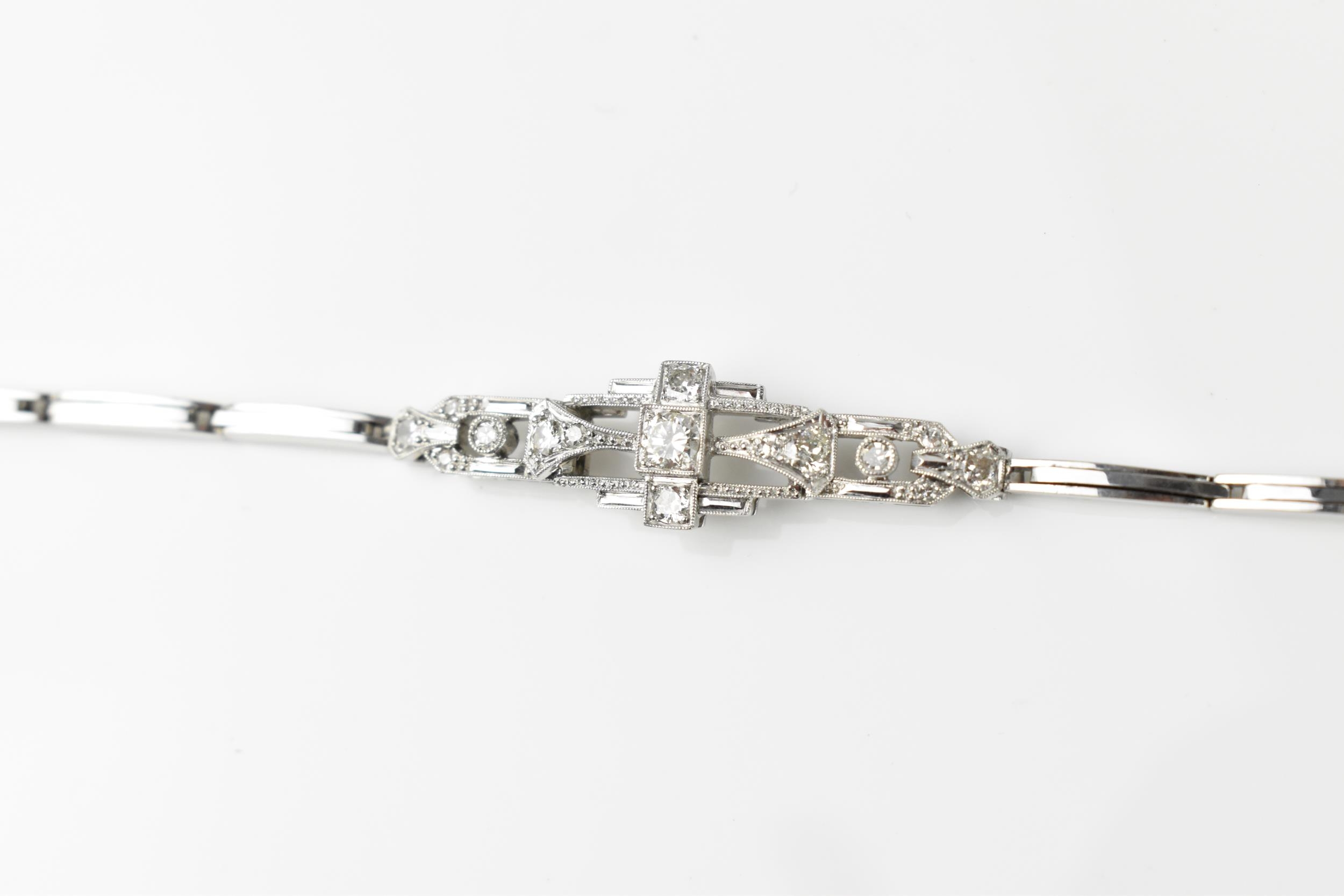 An Art Deco 18ct white gold and diamond bracelet, with stretch bracelet, inset with thirteen central - Image 5 of 11