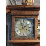 An early 18th century and later walnut veneered longcase clock, the gilt dial signed 'Daniel