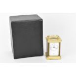 A modern L'Epee brass cased miniature carriage clock, white enamel dial with Roman numerals, the