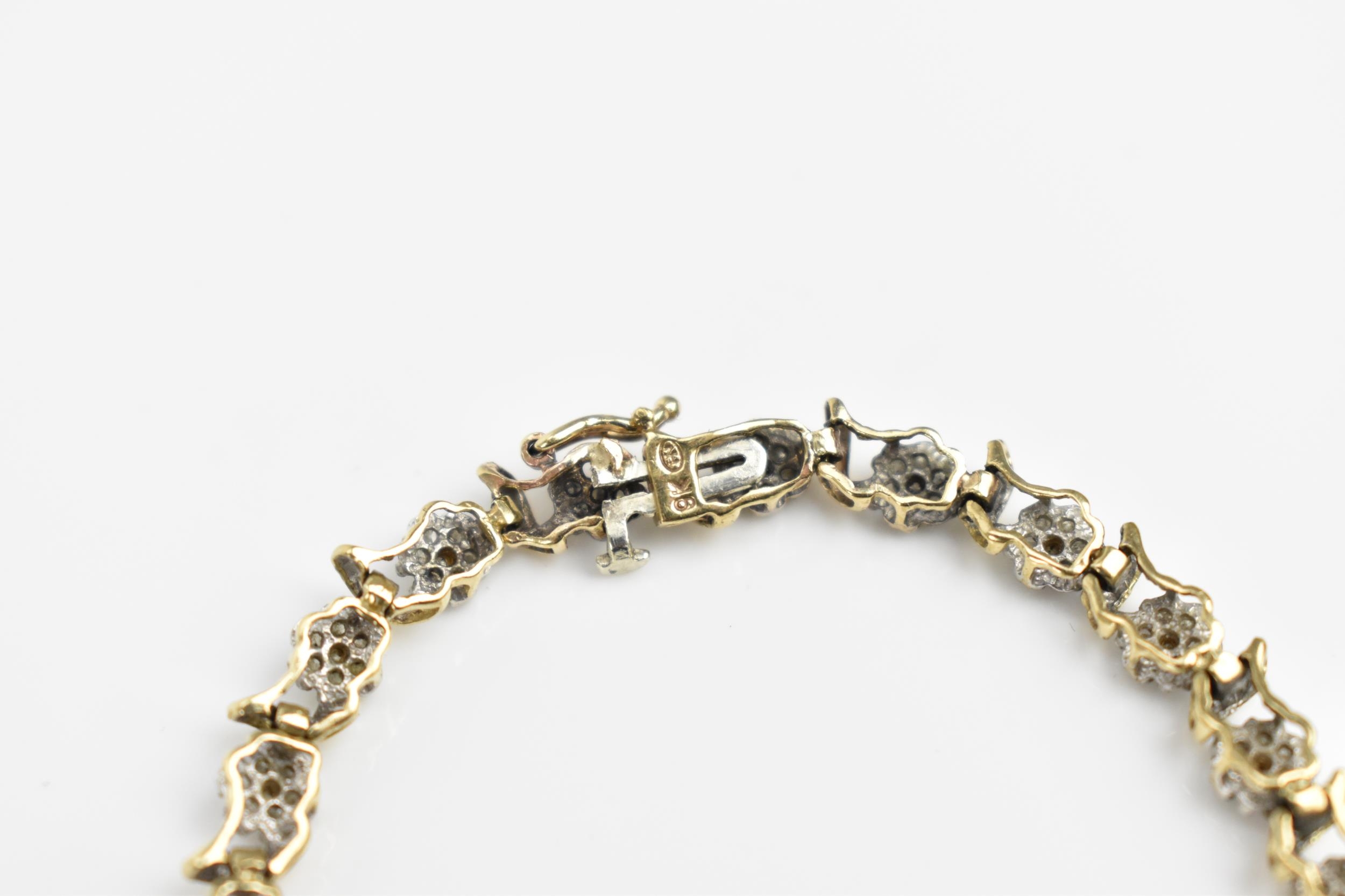 A 9ct yellow gold and diamond bracelet, designed with twenty-seven floral diamond clusters, with - Image 7 of 7