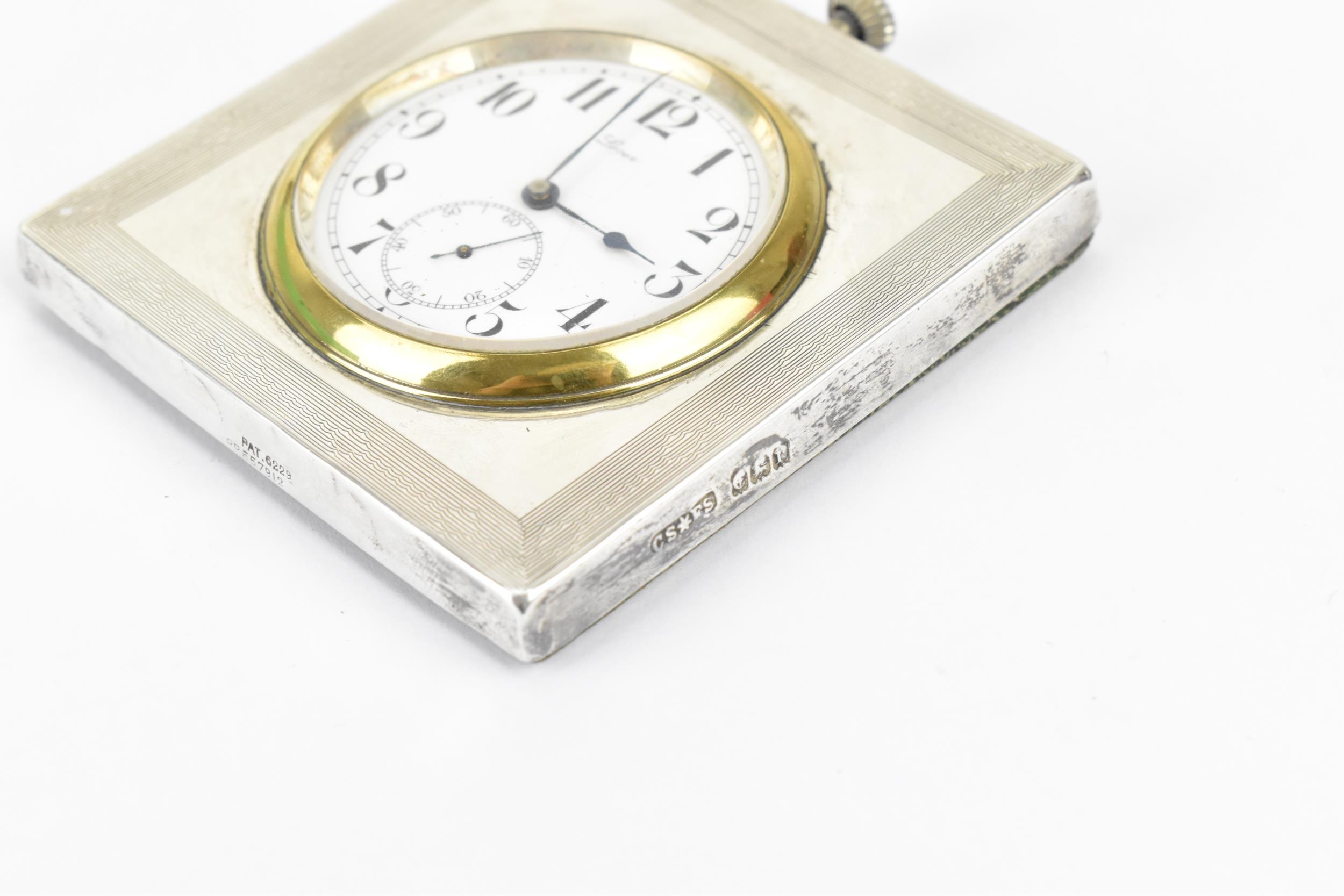 An early 20th century silver cased bedside/travel clock, the winding crown mounted to the top of the - Image 3 of 3