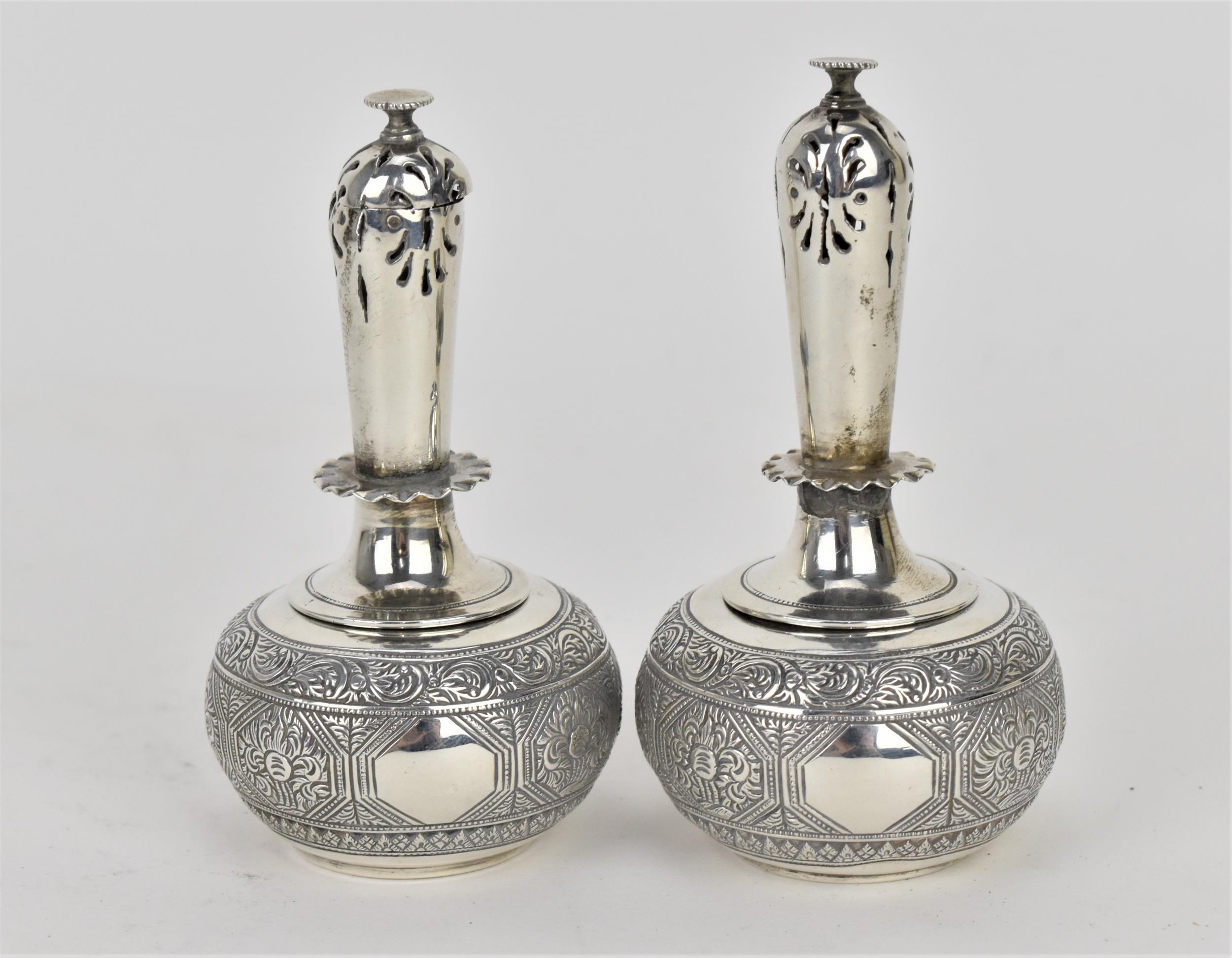 A pair of Victorian silver rosewater sprinklers by George Fox, London 1869, designed with globular