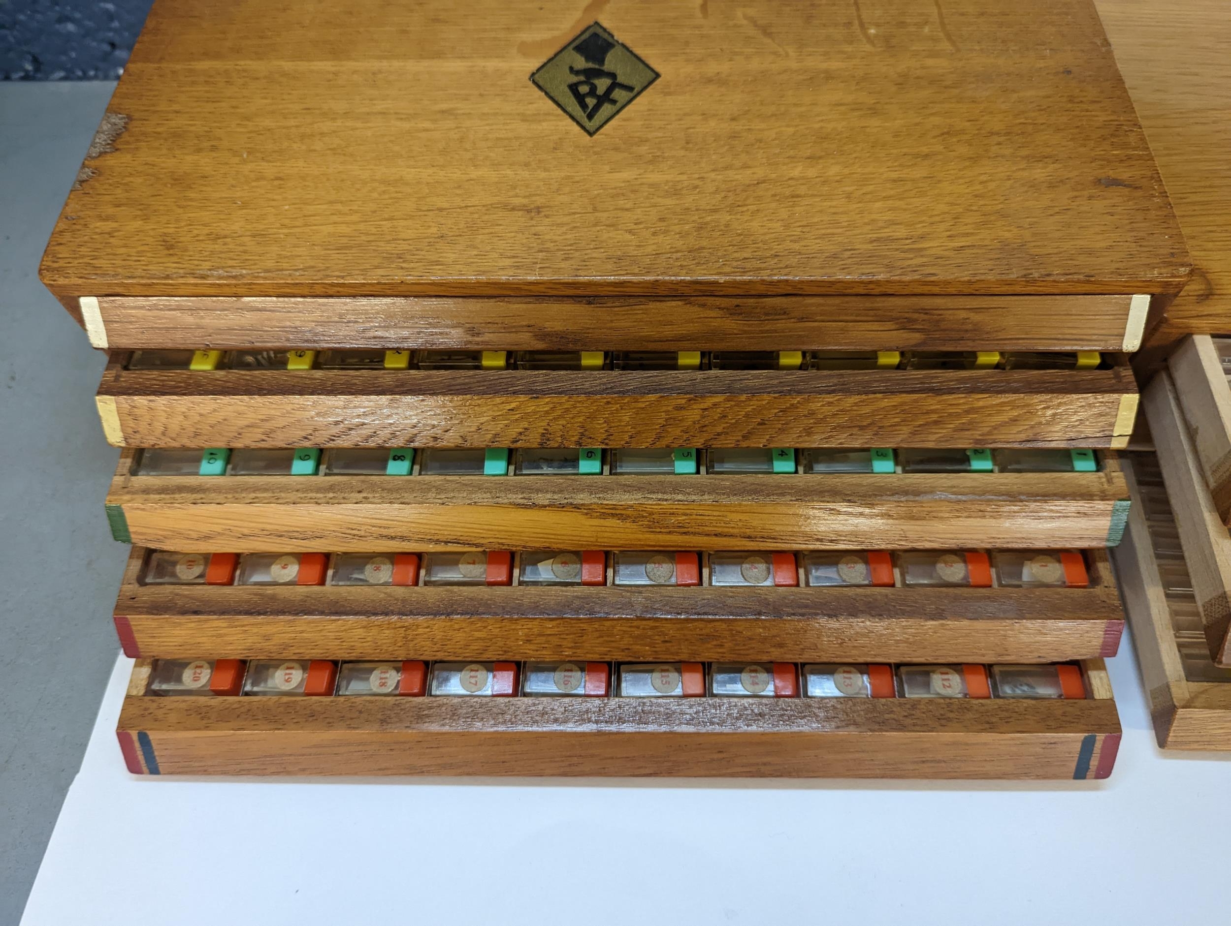 Two vintage oak watchmakers table top drawers containing mainly watch stems together with balances - Image 2 of 9