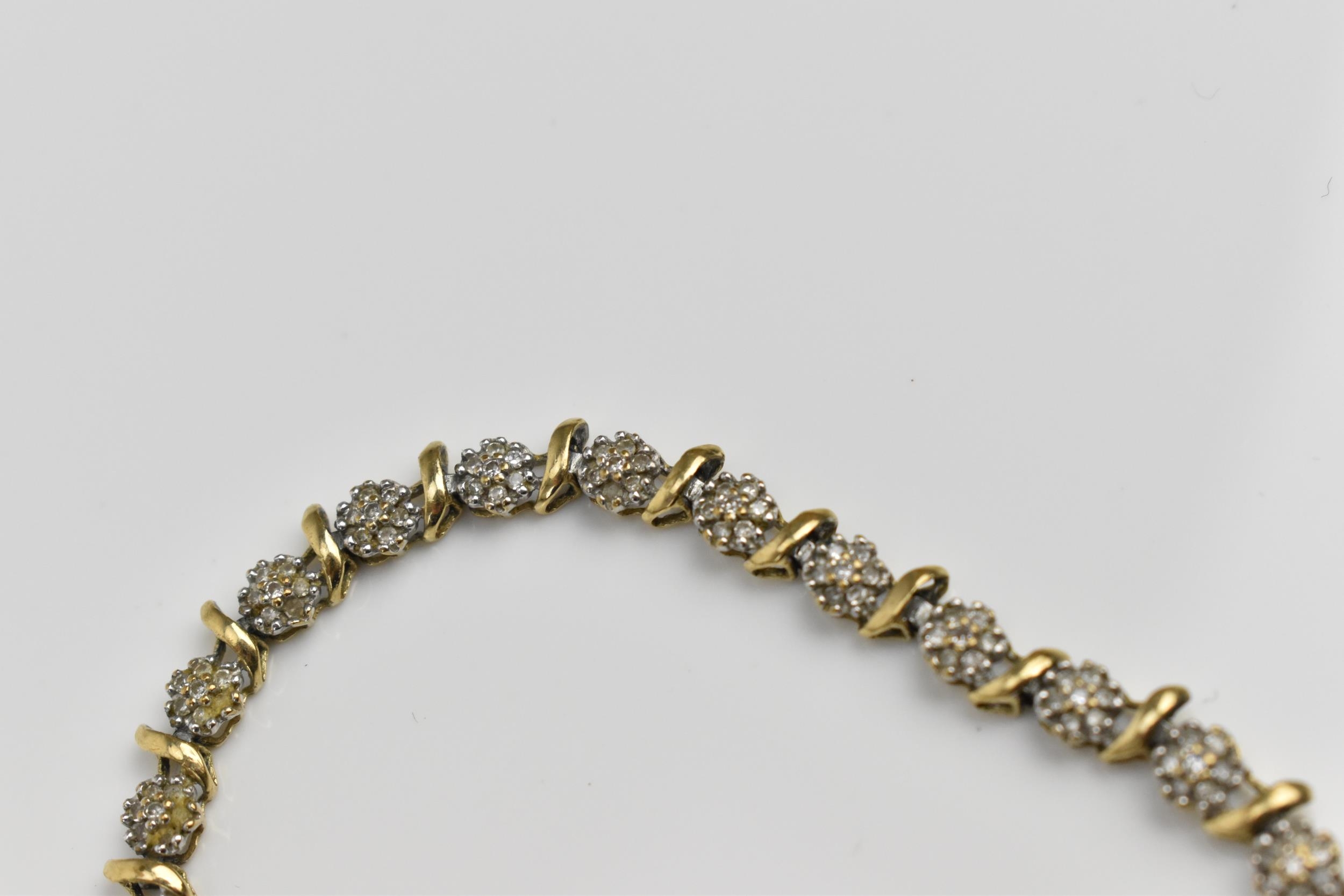 A 9ct yellow gold and diamond bracelet, designed with twenty-seven floral diamond clusters, with - Image 4 of 7