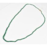 A single strand graduated emerald bead necklace, with 9ct yellow gold and diamond clasp, stamped
