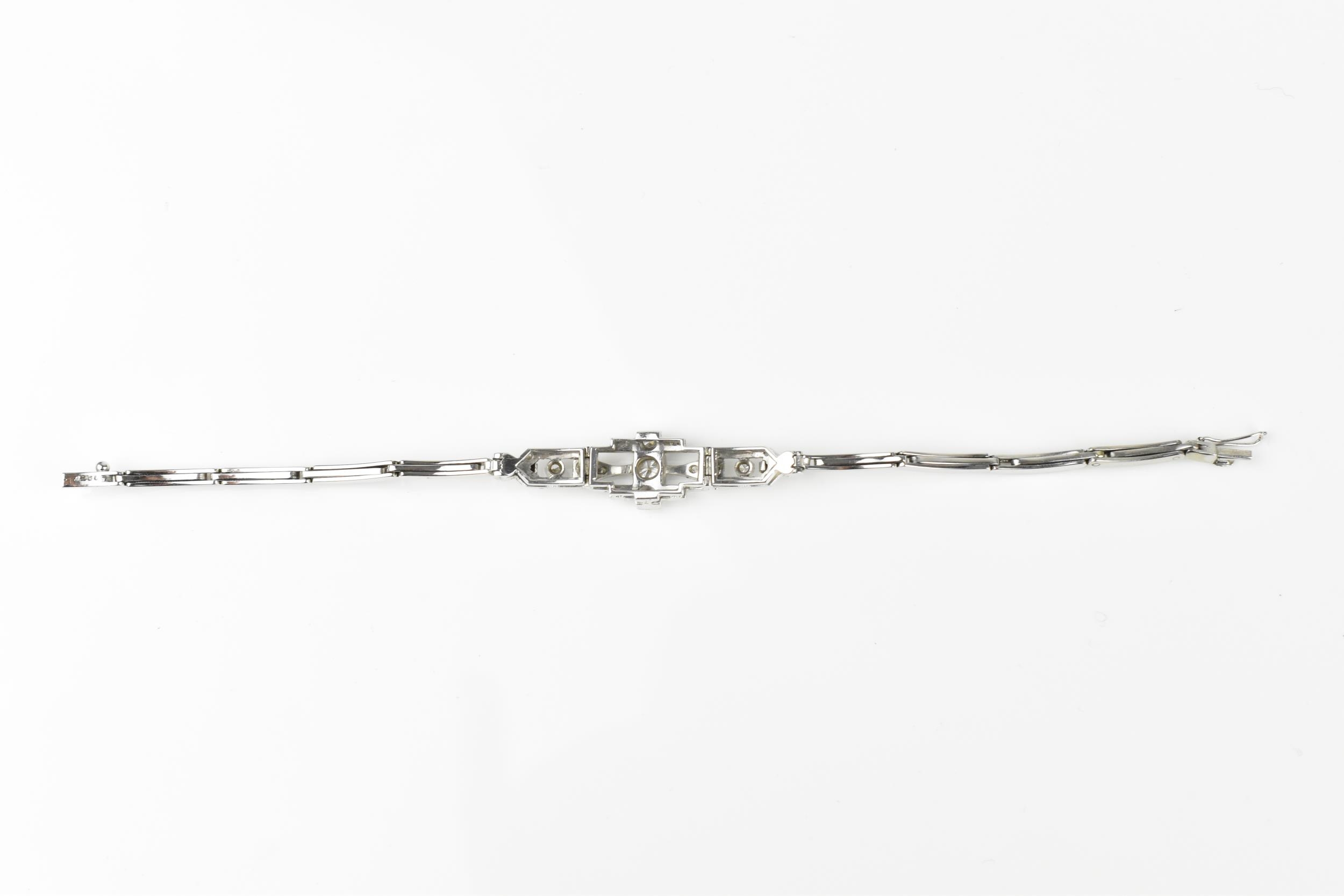 An Art Deco 18ct white gold and diamond bracelet, with stretch bracelet, inset with thirteen central - Image 7 of 11