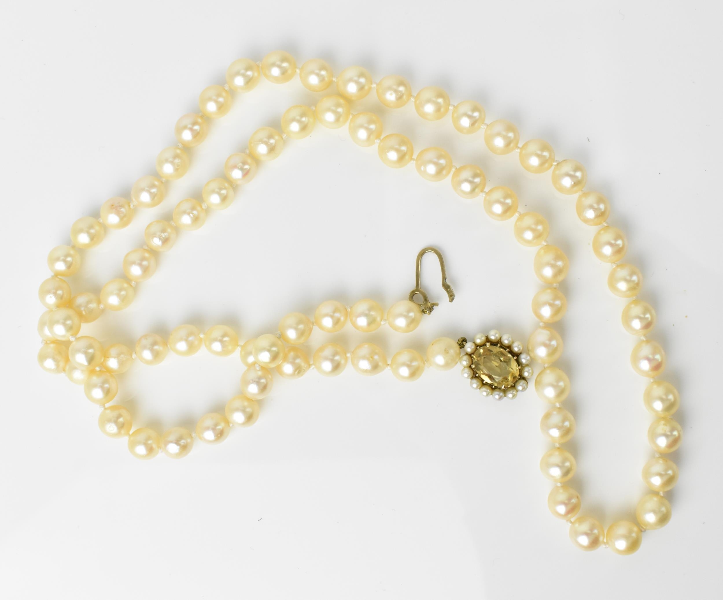 A single strand of cultured white pearls, with 9ct yellow gold, seed pearl and oval cut citrine