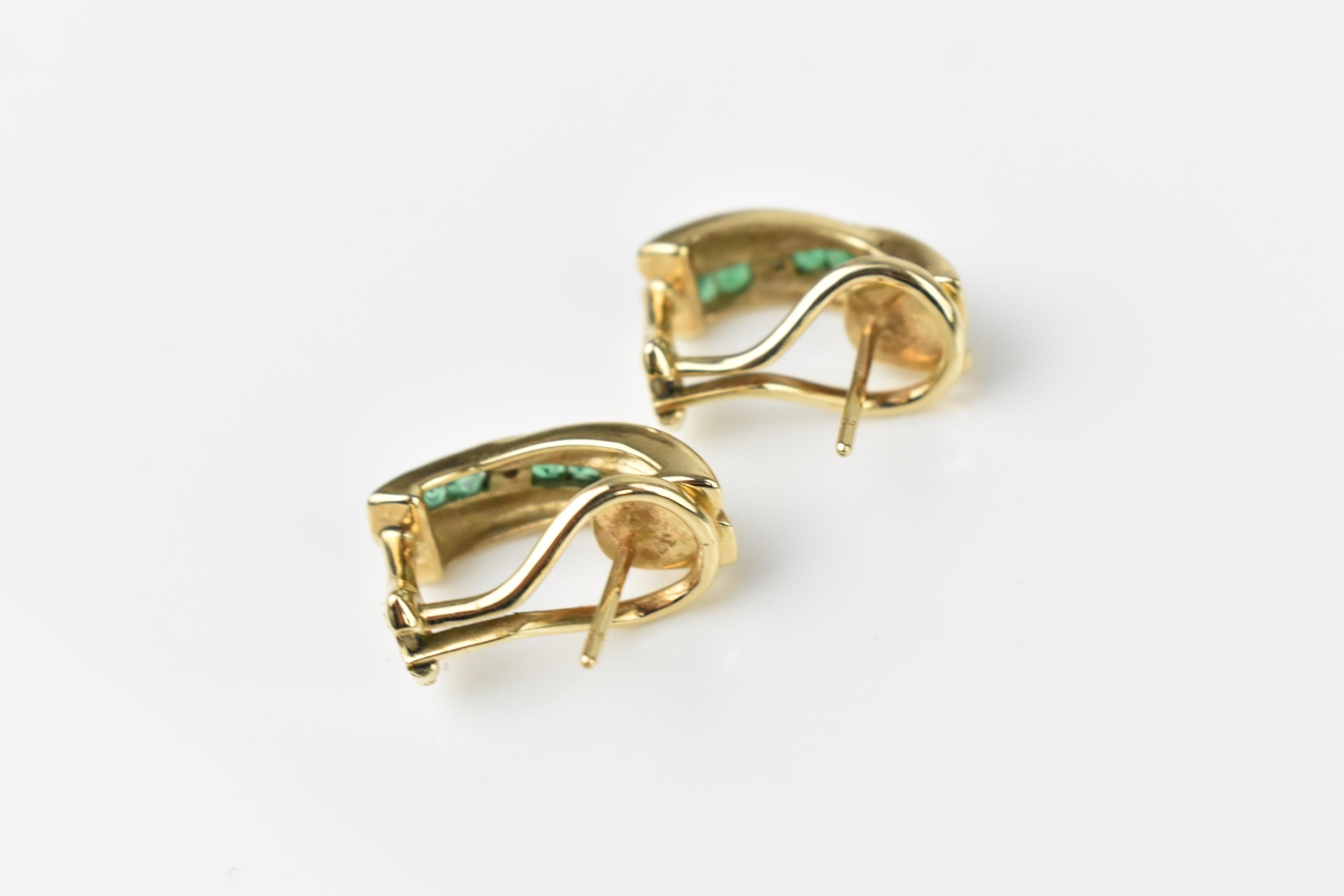 A pair of 9ct yellow gold, diamond and emerald earrings, with channel set princess cut emeralds in - Image 4 of 4