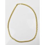 An 18ct yellow gold flat link matinee length necklace, with pressed geometric pattern to the centre,