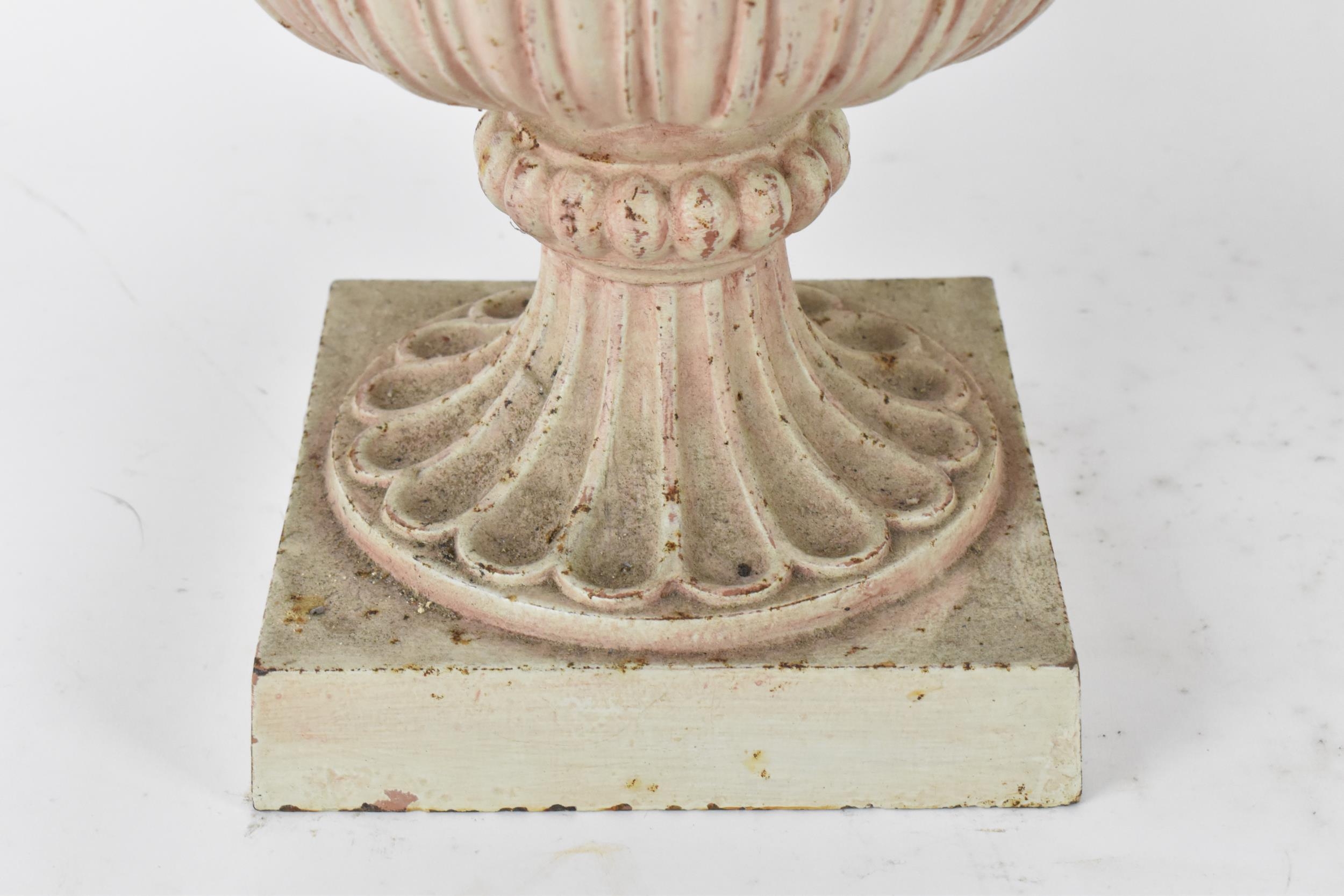 A pair of cast metal garden urns, with everted petal rim, part of the body with cast leaf, on a - Image 4 of 5