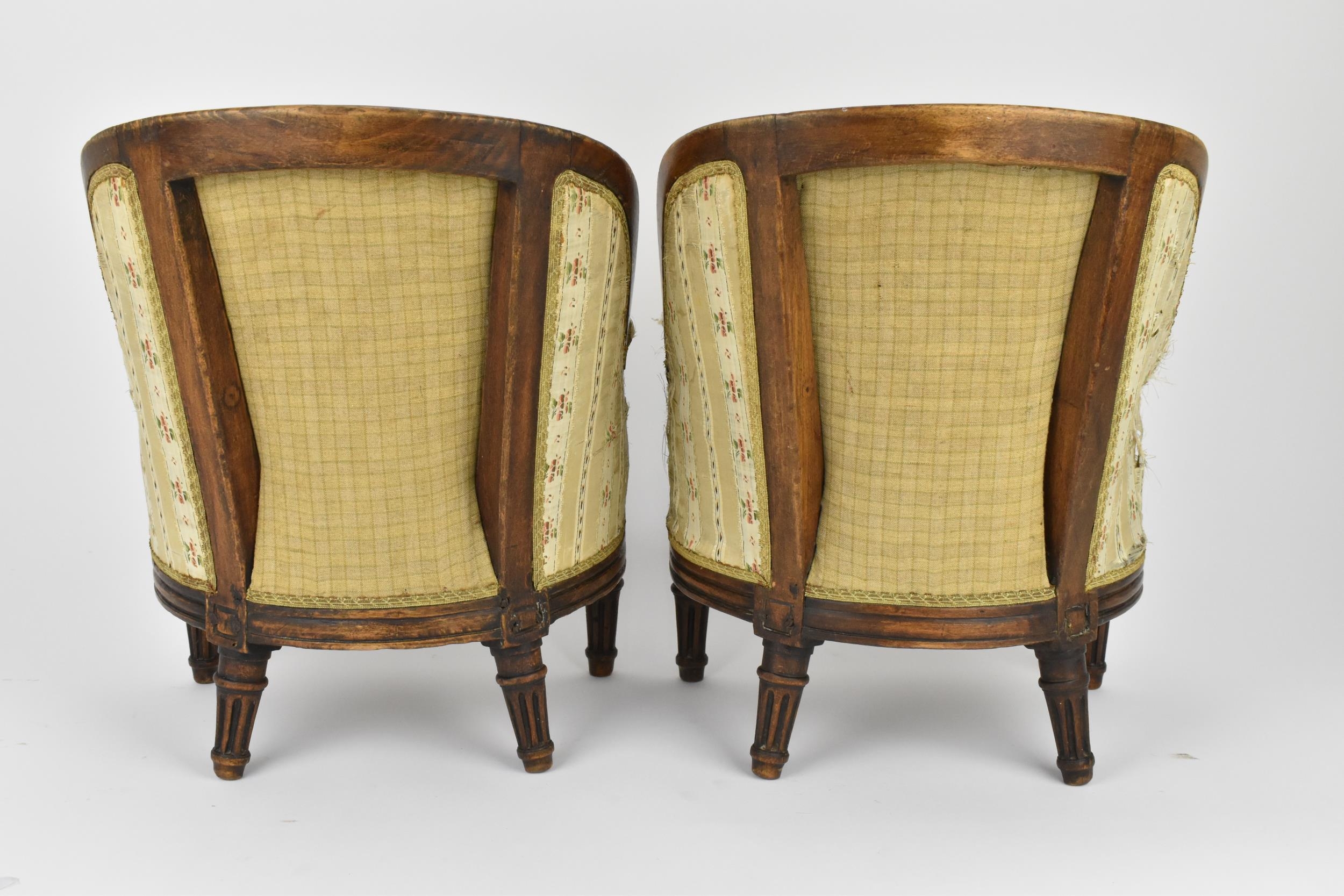 A pair of 18th century French Louis XVI bergère armchairs, circa 1780, with channelled mahogany - Image 4 of 9