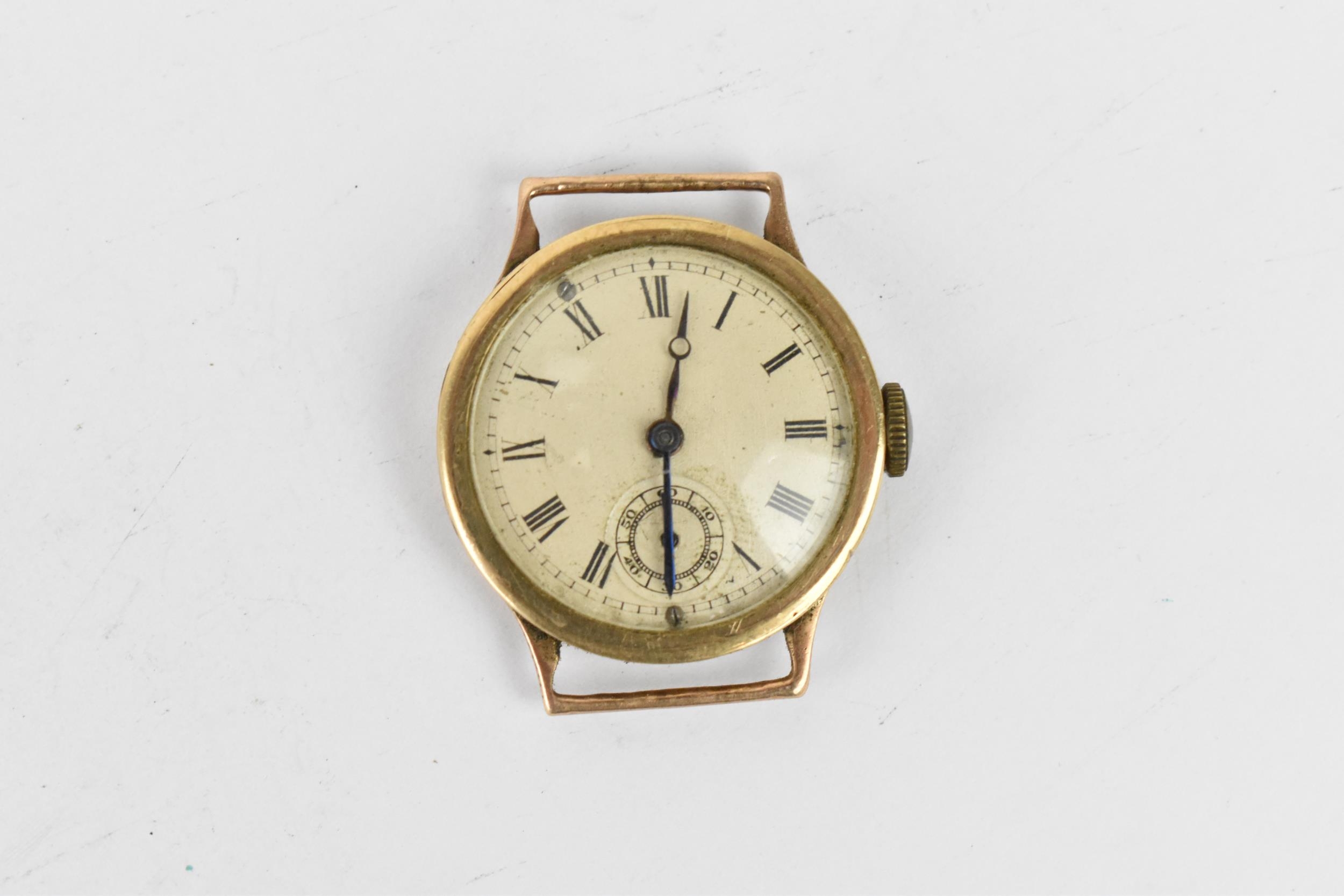 A manual wind, boys size 9ct gold wristwatch having a silvered dial with Roman numerals, blued hands