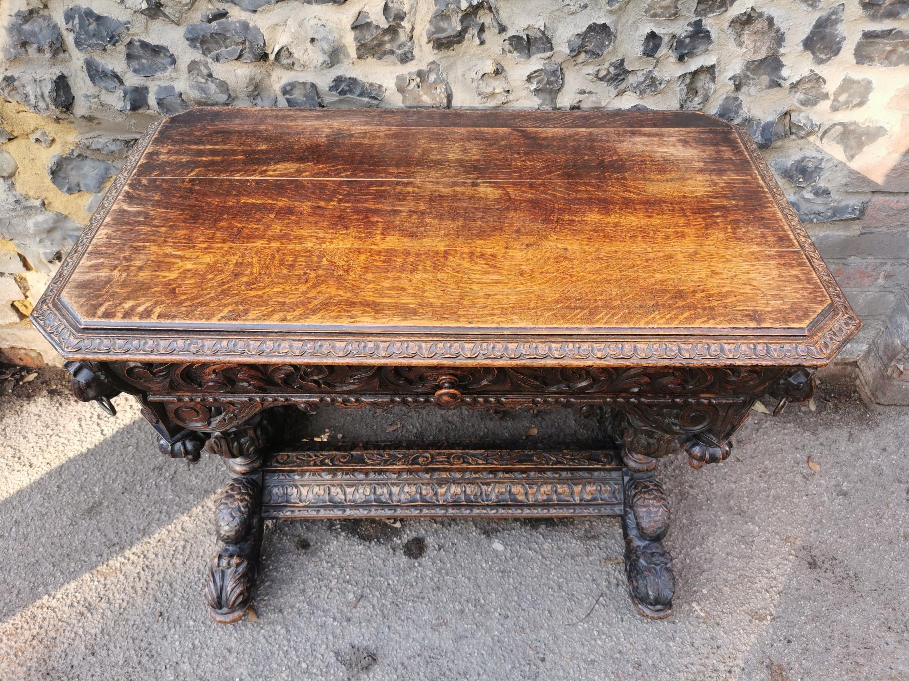 A 19th century Renaissance style carved oak library table, possibly French, with carved dolphin - Image 2 of 7