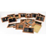 A large collection of Victorian mahogany-framed magic lantern slides, one with lever, the others