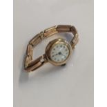 A ladies 9ct gold wristwatch, on an expandable strap, 22.4g Location: