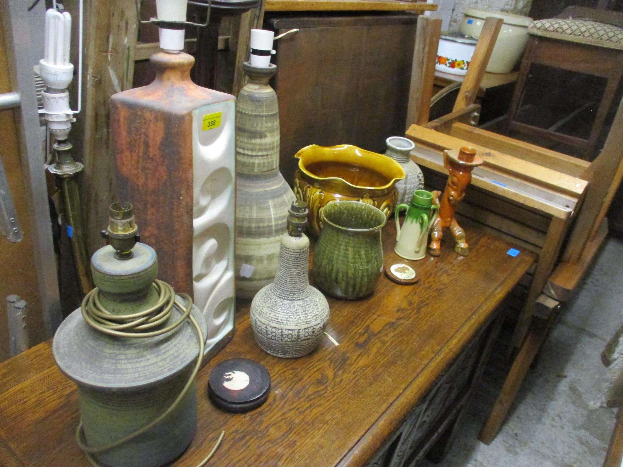 A selection of studio and art pottery table lamps and art pottery to include an Aller vase three