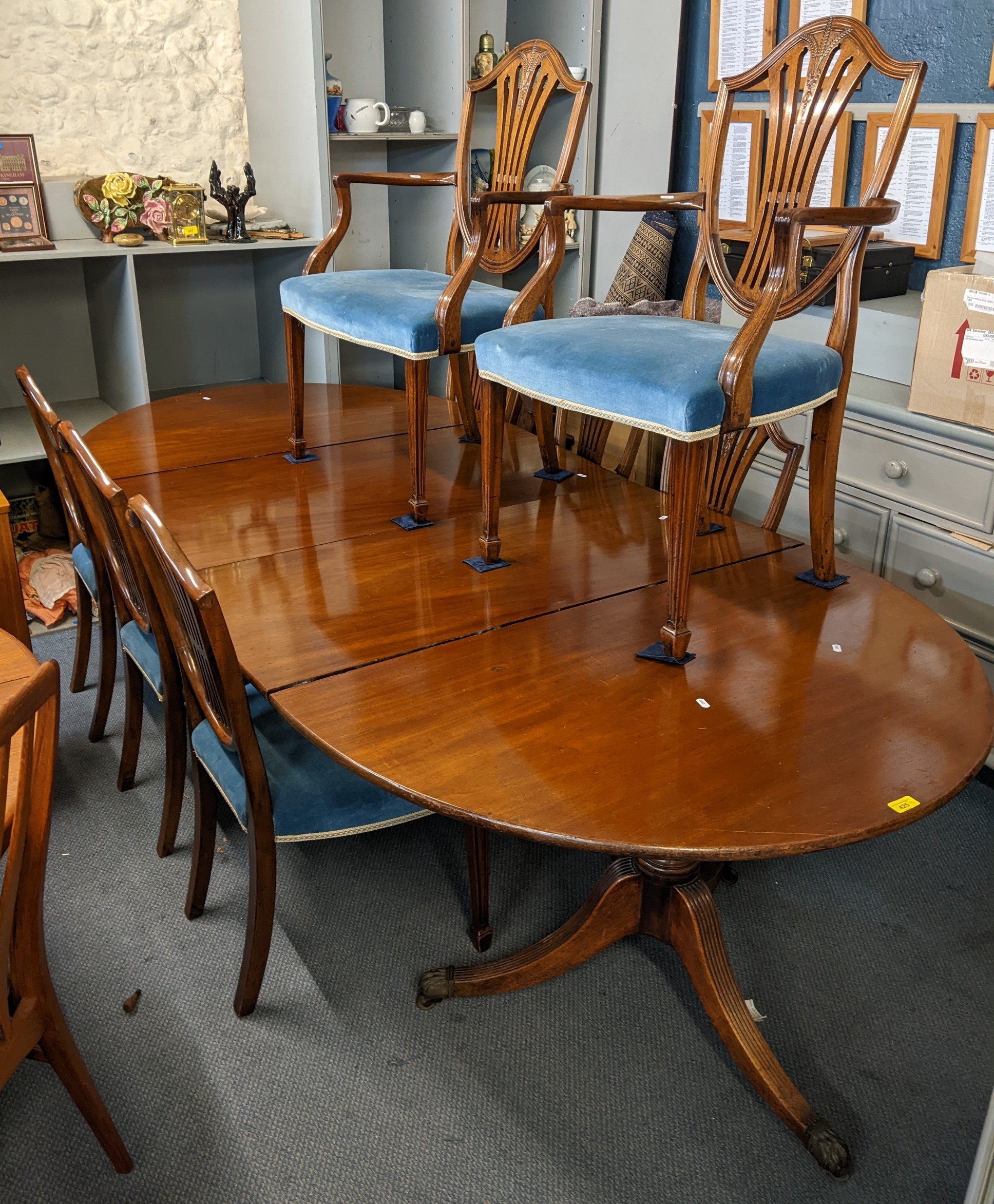 An early 20th century mahogany D-end extending dining table,