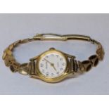 A gold plated ladies Accurist watch on a 9ct gold bracelet, total weight 13.3g Location: