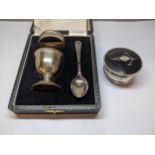 A late 20th century silver three piece Christening set comprising an egg cup, a napkin ring and a