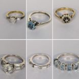 Six silver set rings to include a cluster ring inset with sapphires and paste stones Location: