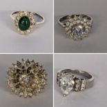 Four boxed silver set rings to include one inset with jade cabochon and paste stones Location: