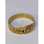 A yellow metal ring reading 'Mizpah', 2.7g Location: