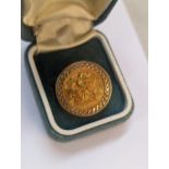 A 1982 half-sovereign inset on a 9ct gold ring, 7.5g Location: