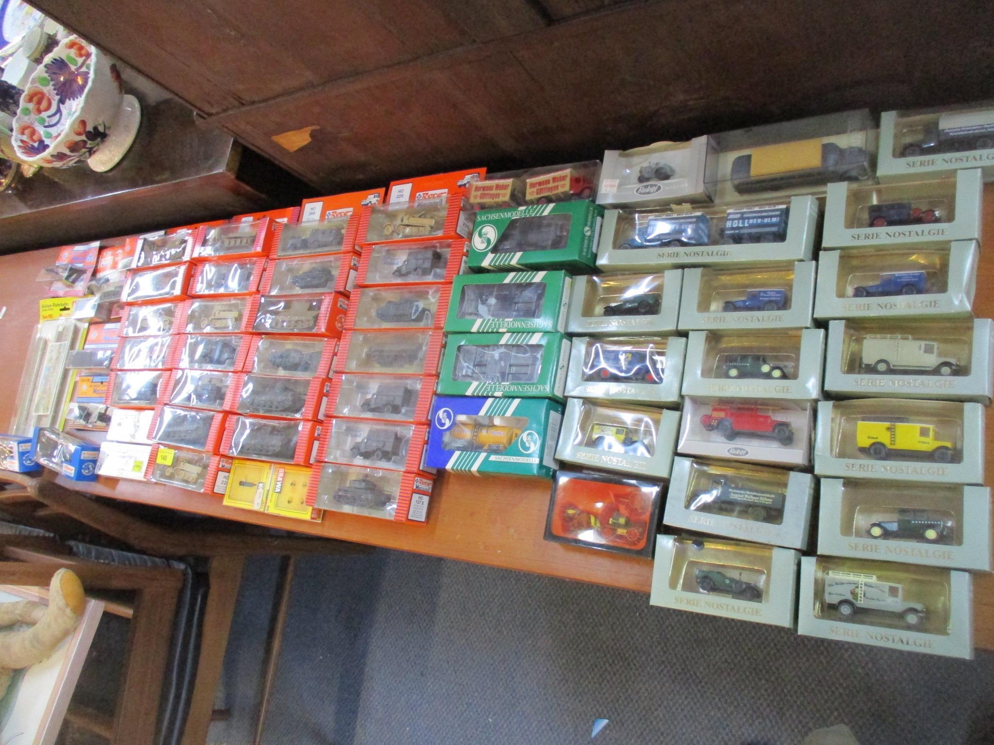 A lot of boxed HO model railway miniatures and accessories to include model vehicles to include Roco