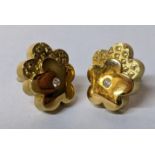 A pair of 18ct gold earrings, each inset with a diamond, 3.5g Location: