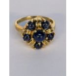 A 9ct gold ring inset with six sapphires, 4.1g Location: