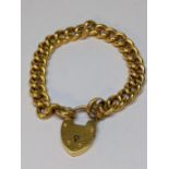 A 15ct gold bracelet with heart shaped locket, 18.9g Location:
