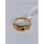 A 18ct gold ring set with a ruby and diamond chips, 2.7g Location: