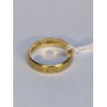 A 18ct gold wedding ring with engraved ornaments, 3.8g Location: