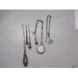 A silver cased pocket watch, two silver pocket watch chains and three silver handled button hooks