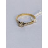 An 18ct gold ring with an illusion set diamond, weight g Location: