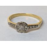 A yellow metal diamond set ring with diamond shoulders, 2.5g Location: