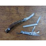 A group of three pocket knives to include a Saynor Coke & Ridad signed obtain, having a horn handle,