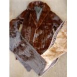 A vintage ermine coat having a shawl collar dyed chestnut, 38" chest x 32" long together with an