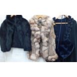 Mixed modern fur clothing to comprising a black fur cape with angora rabbit fur collar, a navy