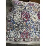 Two small Persian rugs, floral and animal decoration within diamond shaped outlines, triple guard