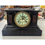 A late 19th Century American Ansonia slate and marble mantle clock having a white enamel dial with