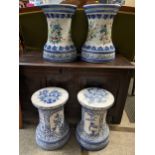 Two pairs of blue and white floral jardiniere stands