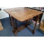 A small oak drop leaf table with bobbin support, 65cmHigh x 83cmWide (extended) x 71cm. Location:BWR