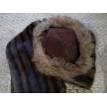 A vintage Russian brown Cossack hat together with a vintage brown musquash fur stole