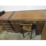 A reproduction mahogany twin pedestal desk, inset red leather tooled top with moulded edge,