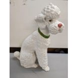 A large ceramic model of a poodle, 56h x 39w