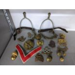 Early 19th century British military items to include a pair of spurs, mixed cap badges to include