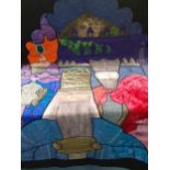 An ornately embroidered and handmade quilt with images of the Three Wise Men, having a black border,